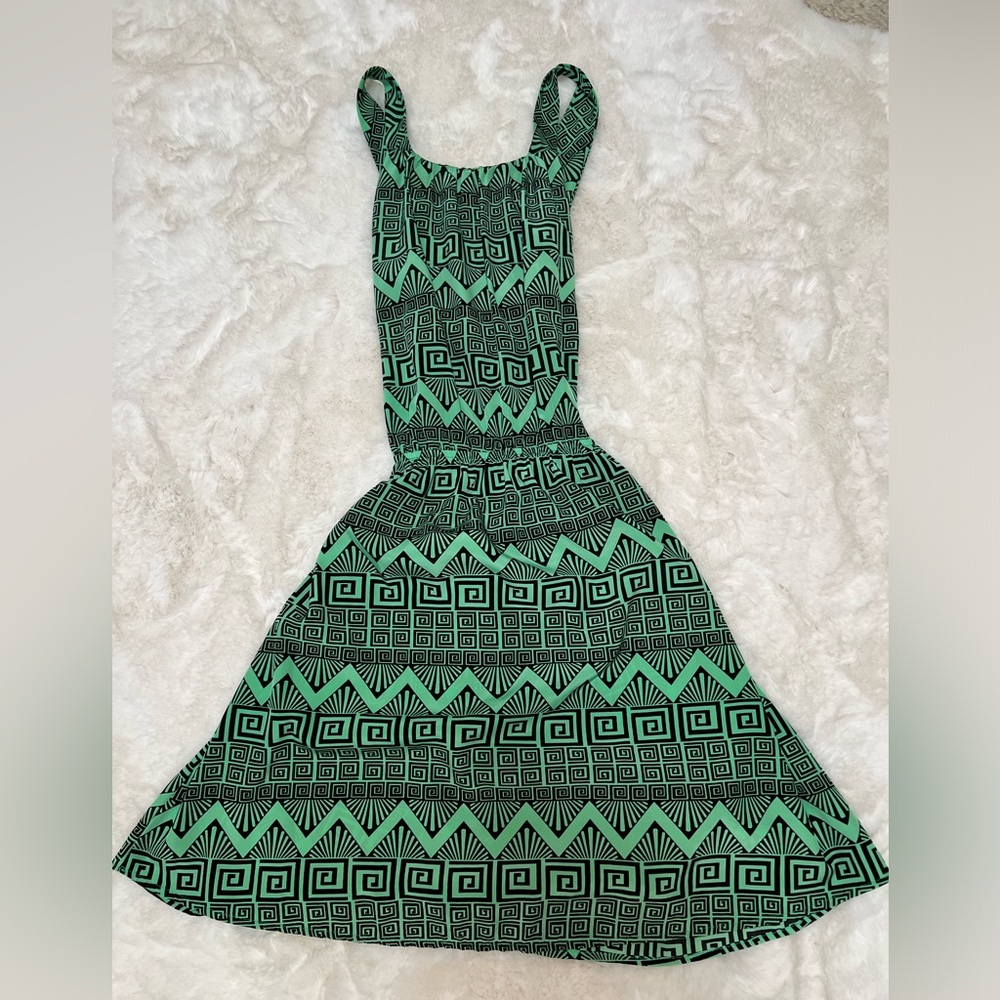 Sleeveless tribal print green and black dress.